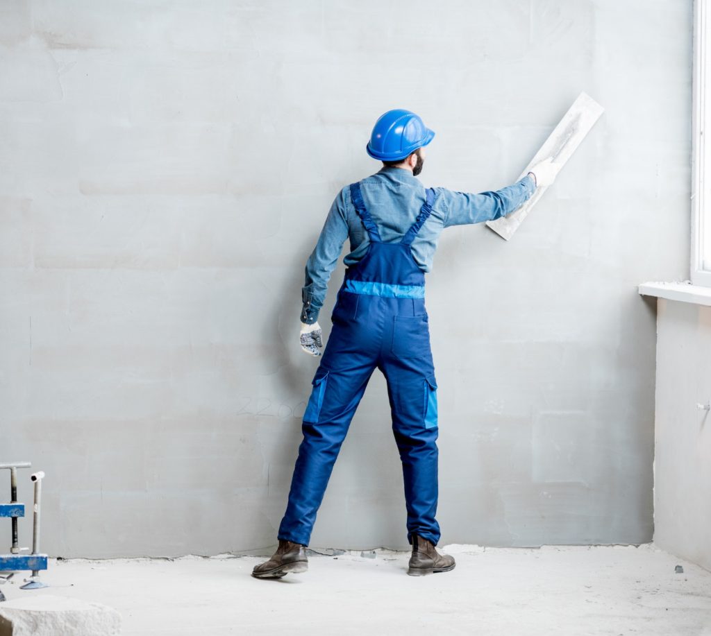 Plasterer working indoors